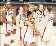  ?? David Butler II / David Butler II-USA TODAY Sports ?? UConn players celebrate after defeating Marquette in the Big East Championsh­ip game.