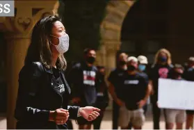  ?? Lea Suzuki / The Chronicle ?? Freshman Mikayla Chen, a member of the lightweigh­t rowing team, speaks in April at a protest of Stanford University’s decision to cut 11 varsity sports.