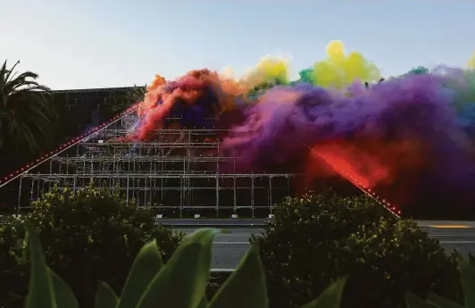  ?? Photos by Yalonda M. James / The Chronicle ?? Colorful smoke fills the air in “Judy Chicago: Forever de Young,” a 15-minute live-streamed event featuring fireworks, pyrotechni­cs and sparklers.