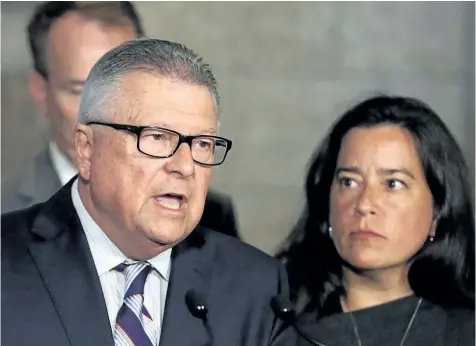  ?? FRED CHARTRAND/ THE CANADIAN PRESS ?? Public Safety Minister Ralph Goodale and Justice Minister Jody Wilson-Raybould hold a news conference Friday on Parliament Hill in Ottawa regarding a $10.5-millon payment to Omar Khadr. The federal government has formally apologized to former...