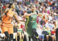  ?? Tim Clayton-Corbis / Corbis via Getty Images ?? Kaleena Mosqueda-Lewis (23) of the Seattle Storm drives to the basket defended by guard Courtney Williams (10) of the Connecticu­t Sun during a WNBA game at Mohegan Sun Arena in 2017 in Uncasville.