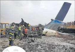  ?? REUTERS ?? Rescue workers at the site of the plane crash at Tribhuvan Internatio­nal Airport i nk athmandu.