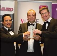  ??  ?? Greg Doyle and Pat Quinn of Brandon House Hotel accepting the Excellence in Hospitalit­y award from Niall Bennett (left), President of New Ross and District Chamber of Commerce sponsor, at the New Ross and District Chamber of Commerce Business and...