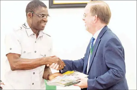  ??  ?? Acting Governor, Edo State, Hon. Philip Shaibu (left), presenting a souvenir to the Charge d’ Affairs and Deputy Chief of Missions United States Embassy in Abuja, David Young, during a courtesy visit by the US envoy to the Government House, in Benin City....yesterday