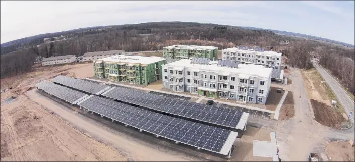  ?? Photos provided by Bruns Realty Group ?? Solar panels, lower left, generate the power for net-zero apartments at Solara, Bruns Realty’s ecoluxury property in Rotterdam. A new project phase is expected to open in August 2022.