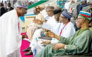  ??  ?? President Muhammadu Buhari chats with Governor Abiola Ajimobi of Oyo State (left), during the 2018 APC National Convention at the Eagle Square in Abuja yesterday. With them from right are Chief John Odigie-Oyegun, APC former chairman; Vice President Prof. Yemi Osinbajo; Senate President Bukola Saraki; APC National Leader, Asiwaju Bola Tinubu; and others PHOTO: State House