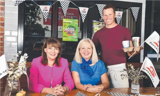  ?? Picture: SHAE BEPLATE ?? TRUE COLOURS: Mayor Jenny Hill, Townsville Chamber of Commerce president Debbie Rains and cafe owner Kymbo Westcott outside Born Wild Cafe, which is one of many Townsville business decorating their shops in support of the Supercars event.