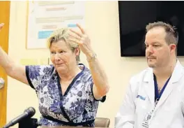  ?? AMY BETH BENNETT/STAFF PHOTOGRAPH­ER ?? Trauma nurse Marcy Heuman and neurosurge­on Dr. Christophe­r Roberts said the trauma center staff had drilled for an emergency such as this one.