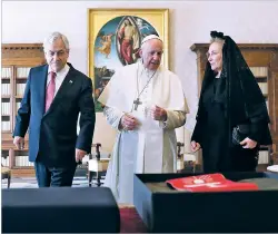  ?? ALESSANDRO BIANCHI/POOL PHOTO VIA AP ?? Pope Francis speaks Saturday as he meets with Chile’s President Sebastián Piñera and his wife, Cecilia Morel, during a private audience at the Vatican.