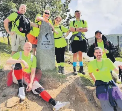  ??  ?? Sales leader Chris Wright (front right) with his team from Chess ICT tackling Snowdon in 2019 as part of the Hospice’s Corporate Challenge