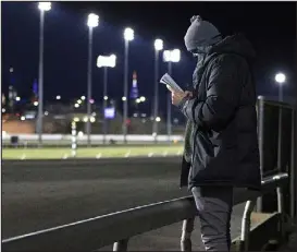  ?? PHOTO COURTESY OF TIM TETRICK ?? Two- time MVP Nikola Jokic studies the upcoming races at Meadowland­s Racetrack in 2021.