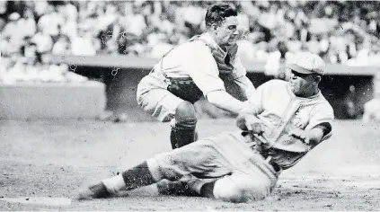  ?? DAVID SHAPINSKY ?? Washington Nationals Herold Dominic ‘Muddy’ Ruel tags out Bing Miller of the Philadelph­ia Athletics during a 1925 game.