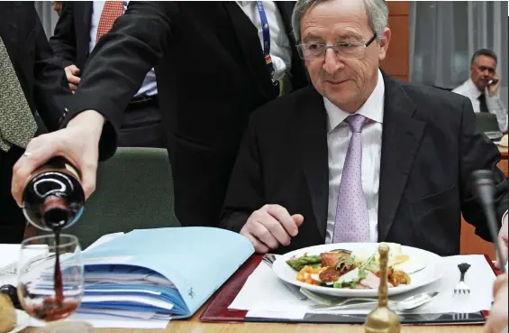  ??  ?? A top-up, sir? Jean-Claude Juncker enjoys a glass of red, likely chosen from the 42,500 fine wines and spirits in the EU’s cellars