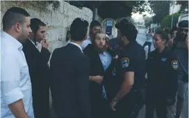  ?? (Udi Shaham) ?? POLICE REMOVE a man from the protest scene in the capital yesterday.