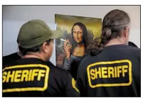  ?? AP/JAE C. HONG ?? Los Angeles County sheriff’s deputies raid an illegal marijuana shop in Compton, Calif., in March.