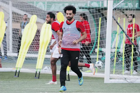  ?? KARIM JAAFAR/GETTY IMAGES ?? Mohamed Salah “prostrates every time he scores and everyone knows he is a Muslim.” Ten per cent of Egypt is Christian, but there are none on the national team.