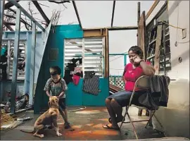  ?? Carolyn Cole Los Angeles Times ?? MANY ARE outraged at leaders’ remarks that made light of post-storm suffering. A week after Maria in 2017, Heydee Perez and her son endured without a roof.