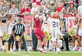  ?? Joe Buvid/Contributo­r ?? Cypress Woods’ Kyler Singletary hauls in a pass for a touchdown Saturday. He reached the end zone twice in the Wildcats’ win, with both scores coming late.