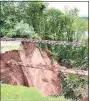  ?? IAFF Local 4662 / Contribute­d photo ?? A massive sinkhole opened up following storm Ida, leaving the railroad tracks in the air near the 13th hole at the TPC at River Highlands in Cromwell.