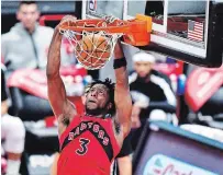  ?? JULIO AGUILAR GETTY IMAGES FILE PHOTO ?? Toronto’s OG Anunoby dunks against the New Orleans Pelicans at Amalie Arena in Tampa, Fla., in December. The Raptors will play all their home games in Tampa this season due to the pandemic. For the result of Thursday night’s game between the Raptors and the Boston Celtics, visit our website.