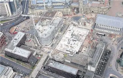  ??  ?? > An aerial image shows Centenary Way being prepared for reopening and below, the demolition of the library