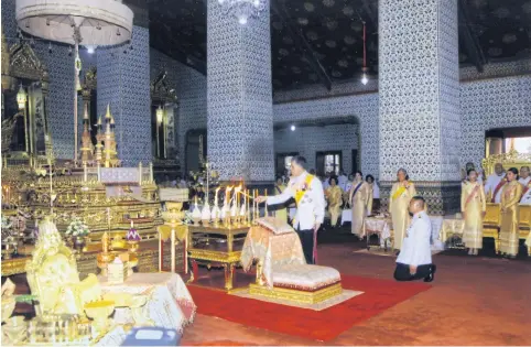  ?? THE ROYAL HOUSEHOLD BUREAU ?? His Majesty the King presides over a merit-making ceremony to mark the birthday of King Bhumibol Adulyadej at Amarin Winitchai Throne Hall in the Grand Palace yesterday. Her Royal Highness Princess Maha Chakri Sirindhorn, HRH Princess Bajrakitiy­abha and HRH Princess Sirivannav­ari Nariratana also attended the ceremony.