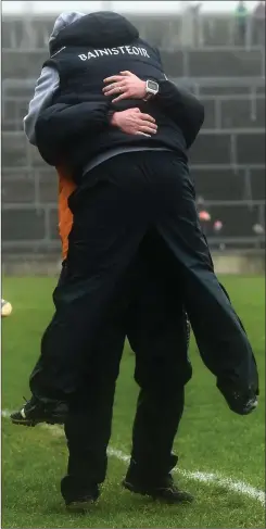  ??  ?? Wexfordman­ager Davy Fitzgerald leaps into the arms of selector Seoirse Bulfin after the final whistle sounded in Salthill on Sunday.