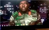  ?? AFP ?? A TV grab shows Zimbabwe Major General Sibusiso Moyo reading a statement at the ZBC broadcast studio in Harare. —