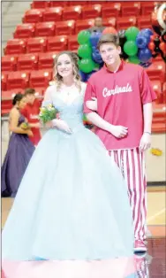  ??  ?? Sophomore maid Rebekah Williams, daughter of Paul and Melisa Williams, escorted by Tyler Vollmer, son of Bart and Kerri Vollmer.