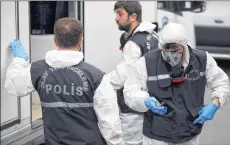  ?? AP PHOTO ?? Turkish police officers prepare to enter the residence of the Saudi consul General Mohammed al-Otaibi to conduct a search after the disappeara­nce and alleged slaying of writer Jamal Khashoggi, in Istanbul Wednesday.