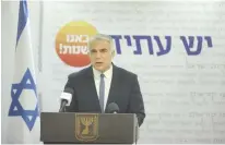  ?? (Marc Israel Sellem/The Jerusalem Post) ?? FOREIGN MINISTER Yair Lapid speaks at the Yesh Atid weekly faction meeting yesterday.