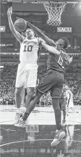  ?? Karen Warren / Houston Chronicle ?? Rockets center Clint Capela (15) goes up for a block against the Spurs’ David Lee in the first half. Capela finished with 20 points, 13 rebounds and two blocks.