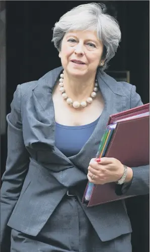  ?? PICTURES: PA WIRE. ?? CLIFF EDGE: Prime Minister Theresa May has revealed that Government department­s are being given millions of pounds to prepare for a so-called hard Brexit and the prospect of no trade deal with the EU.