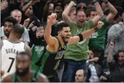  ?? STEVEN SENNE — THE ASSOCIATED PRESS ?? Boston Celtics forward Jayson Tatum (0) celebrates after making a layup at the buzzer to score and end Game 1 of an NBA basketball first-round Eastern Conference playoff series against the Brooklyn Nets, Sunday in Boston. The Celtics won 115-114.