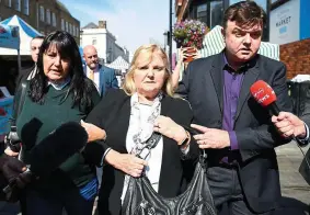  ??  ?? Family: Dolores’s mother Eileen, centre, after yesterday’s inquest