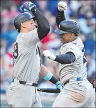  ?? David Dermer The Associated Press ?? Juan Soto, right, celebrates with Aaron Judge after hitting a three-run homer in the Yankees’ 8-2 triumph over the Guardians on Saturday.