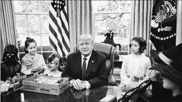  ??  ?? President Trump meets with children of members of the press for Halloween in the Oval Office of the White House in Washington, DC, on Friday. — AFP photo
