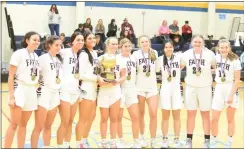  ?? MIKE CABREY — MEDIANEWS GROUP ?? The Faith Christian girls basketball team poses with the Bicentenni­al Athletic League Tournament championsh­ip trophy after its 40-33 win over The Christian Academy on Saturday.