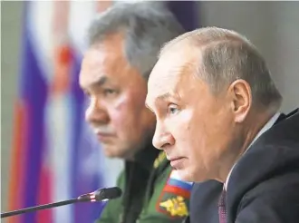  ?? MIKHAIL KLIMENTYEV/ SPUTNIK VIA AP ?? Russian President Vladimir Putin, with Defense Minister Sergei Shoigu, at a meeting in Balashikha, outside Moscow, on Friday.