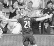  ?? JOHN RAOUX/ASSOCIATED PRESS ?? Orlando City’s Scott Sutter celebrates in front of fans after scoring a goal in stoppage time to force a draw.