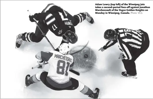  ??  ?? Adam Lowry (top left) of the Winnipeg Jets takes a second-period face-off against Jonathan Marchessau­lt of the Vegas Golden Knights on Monday in Winnipeg, Canada.