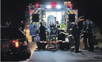  ?? GREG FURMINGER ?? A Niagara Regional Police officer is put into an ambulance after being shot on Oct. 10, 2015.