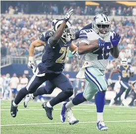  ??  ?? The Cowboys’ Alfred Morris runs with the ball during a recent game.