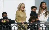  ?? MANUEL BALCE CENETA — THE ASSOCIATED PRESS ?? First lady Jill Biden, singer Ciara Princess Wilson, right, with her children Future Zahir, 7, Sienna Princess, 4, and Win Harrison Wilson, 1, watch from the White House balcony as President Joe Biden leaves the White House on Marine One, Wednesday, Nov. 17, 2021, in Washington. Biden is traveling to visit the General Motors’ electric vehicle assembly plant in Detroit.