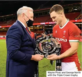  ??  ?? Wayne Pivac and George North with the Triple Crown trophy