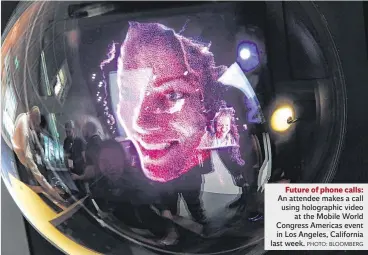  ??  ?? Future of phone calls: An attendee makes a call using holographi­c video at the Mobile World Congress Americas event in Los Angeles, California last week. PHOTO: BLOOMBERG