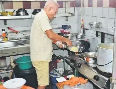  ??  ?? Choa in action in his kitchen.