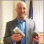  ?? EVAN BRANDT — DFM ?? W. Tid Griffin, president and CEO of Owensboro, Ky.-based Gryphon Environmen­tal LLC, holds two jars of processed sludge. In his right hand is the powder produced by the current sludge dryer at the Pottstown Wastewater Treatment Facility. In his left...