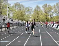  ?? PAUL DICICCO — FOR THE NEWS-HERALD ?? University’s Michael Beros crosses the line as the Preppers prevail in 4x100 on May 1 during the Mentor Cardinal Relays.