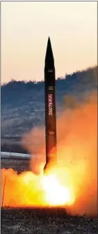  ??  ?? DEADLY THREAT: A missile blasts off during a test launch in North Korea